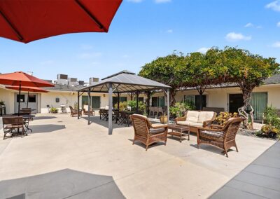 outside waiting area with chairs and flowers