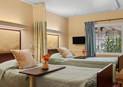 sleeping area with two clean beds up close