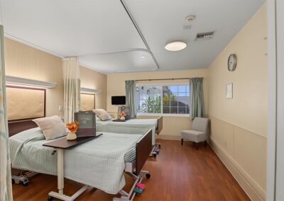 sleeping area with two clean beds and a welcome bag for new guests